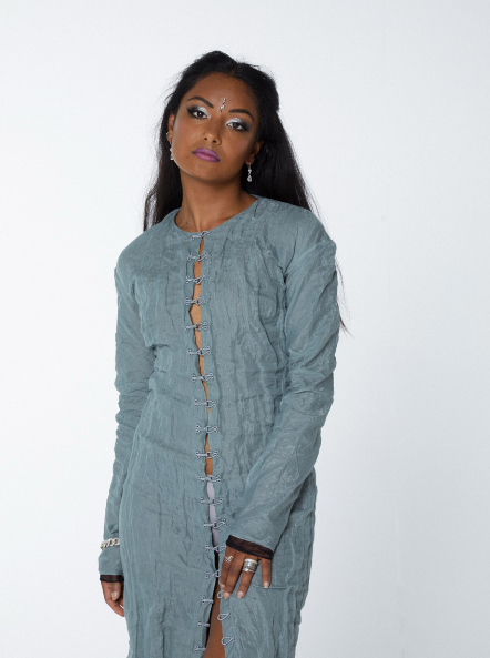 Et.actitude portrait in a sage crinkled dress