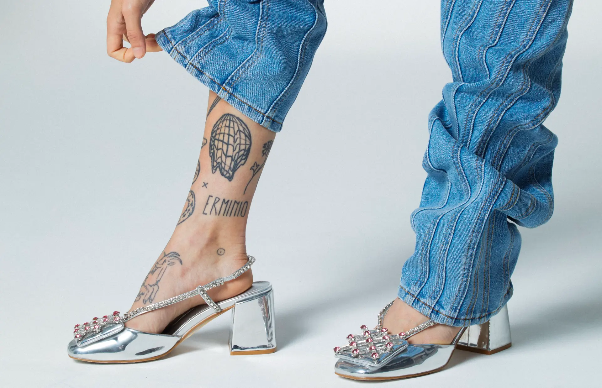 Detailed fashion styling with denim and silver shoes